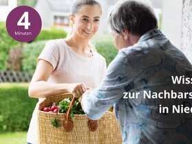 Junge Frau überreicht einen Korb mit Lebensmitteln
